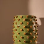 SAGE GREEN VASE WITH GOLDEN LIPSTICKS
